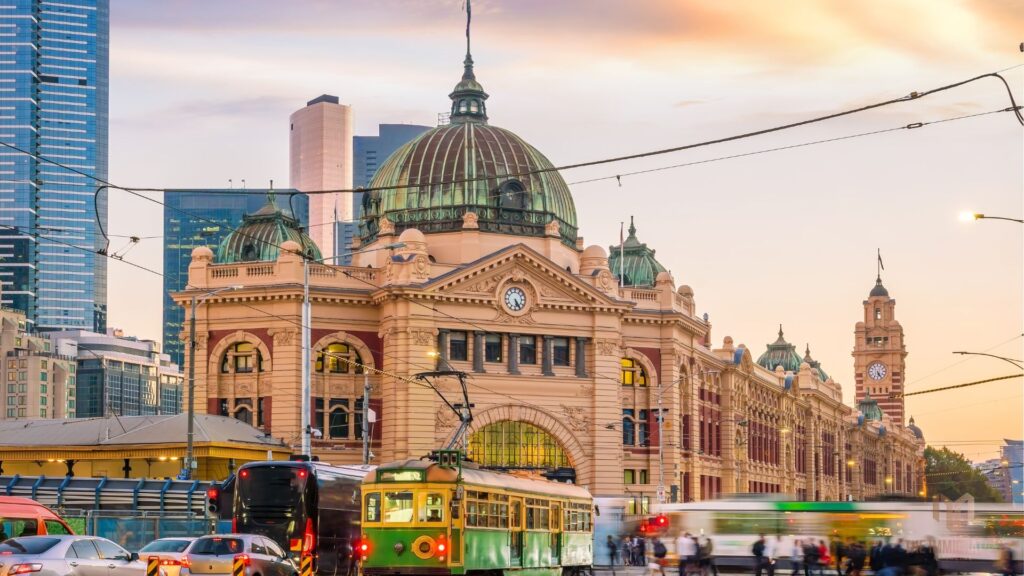 Skilled professional walking near Sydney Harbour Bridge, symbolizing Australia’s Global Talent Visa 858 pathway to PR in 2025.